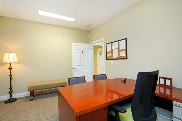 a room with a table and chairs