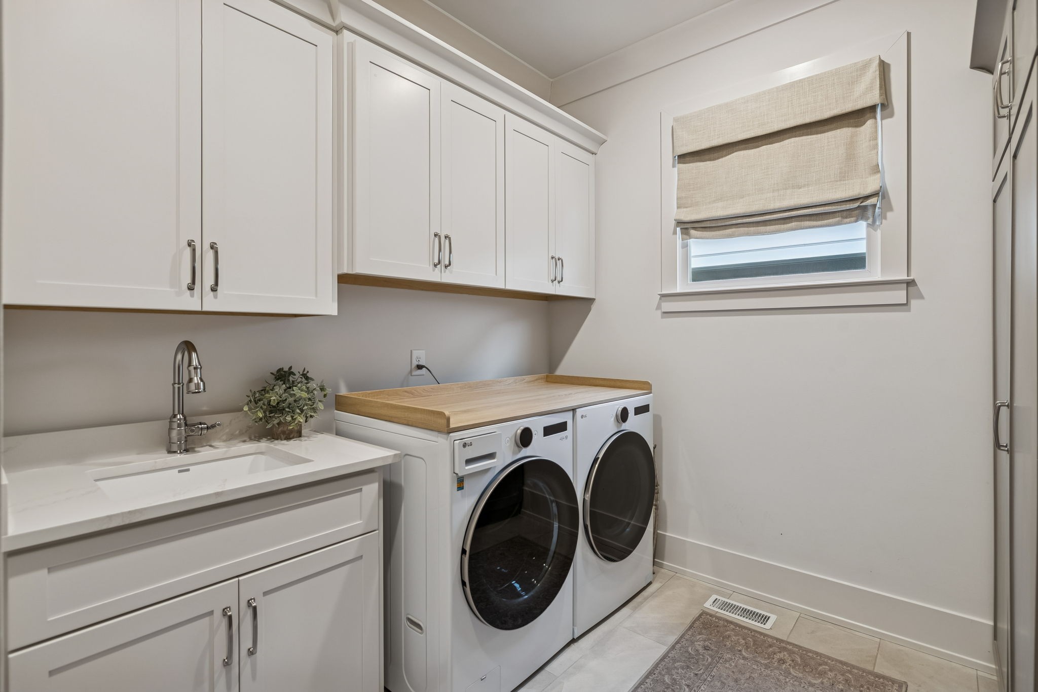 1013 William Street Franklin, TN 37064 - Photo 27 of 57 a utility room with sink dryer and washer