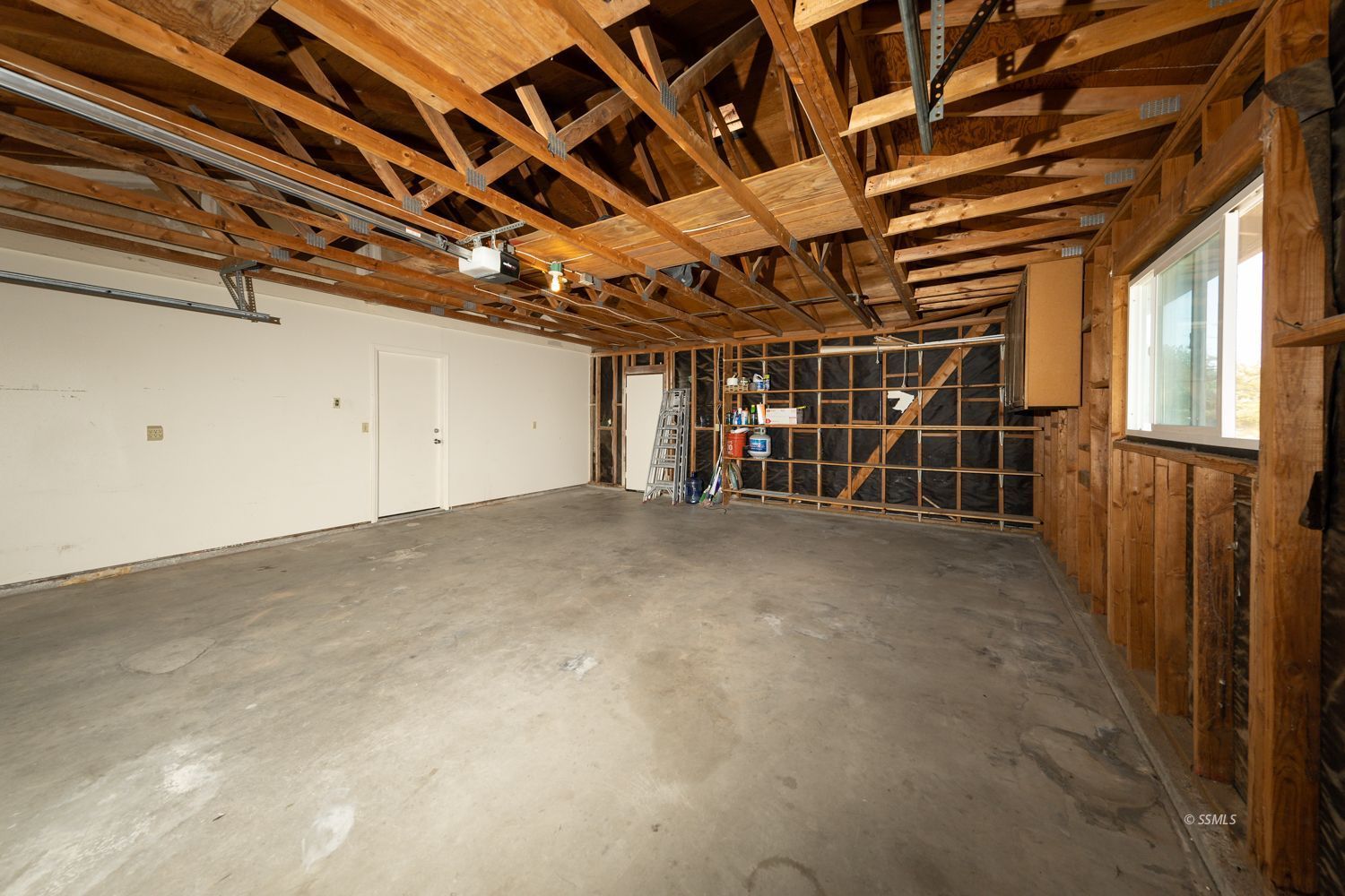 1240 West Boston Avenue Ridgecrest, CA 93555 - Photo 19 of 38 a view of a room with wooden walls