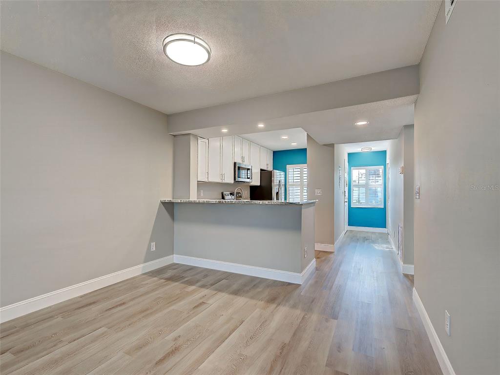 429 Cerromar Lane, Unit 352 Venice, FL 34293 - Photo 15 of 47 a view of kitchen and wooden floor