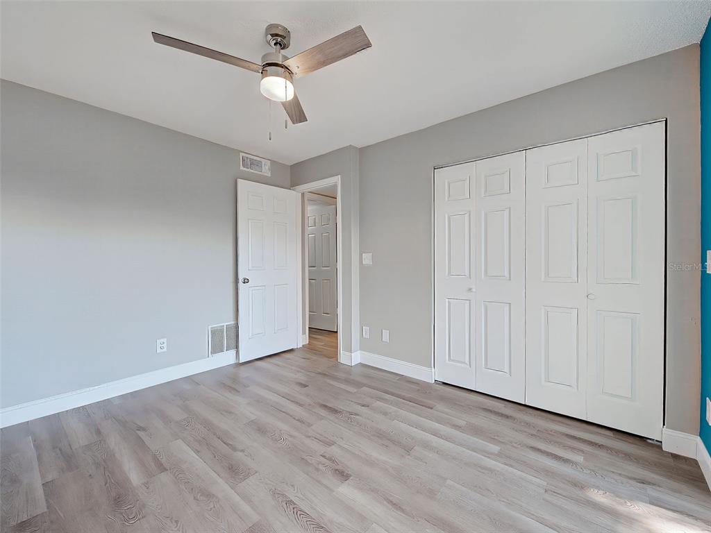 429 Cerromar Lane, Unit 352 Venice, FL 34293 - Photo 29 of 47 wooden floor in an empty room