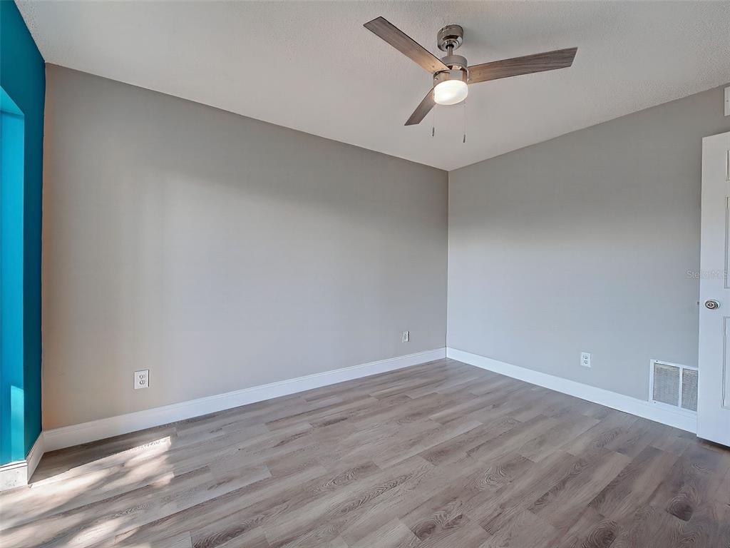429 Cerromar Lane, Unit 352 Venice, FL 34293 - Photo 30 of 47 wooden floor in an empty room