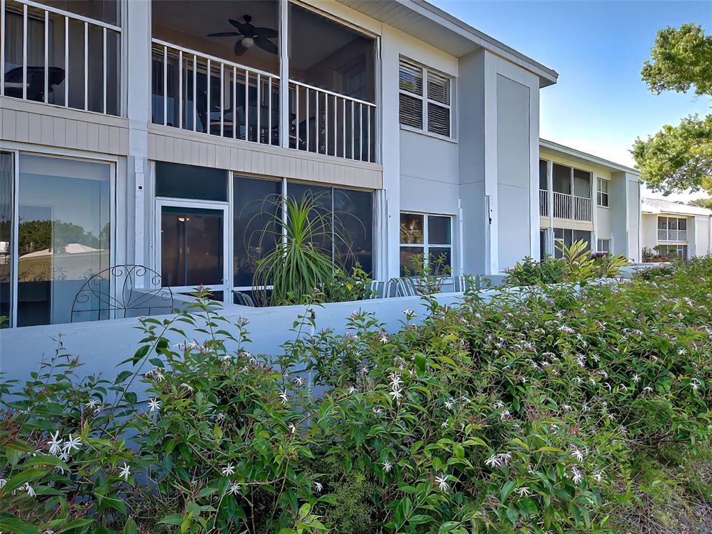429 Cerromar Lane, Unit 352 Venice, FL 34293 - Photo 37 of 47 front view of a house with a yard