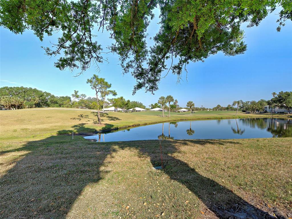 429 Cerromar Lane, Unit 352 Venice, FL 34293 - Photo 39 of 47 a view of a lake with houses in the back