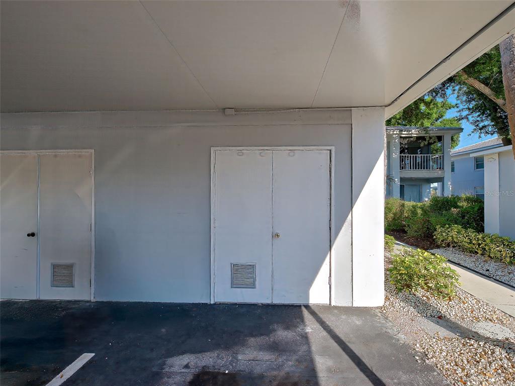 429 Cerromar Lane, Unit 352 Venice, FL 34293 - Photo 40 of 47 a view of a hallway to a house with wooden floor and entryway