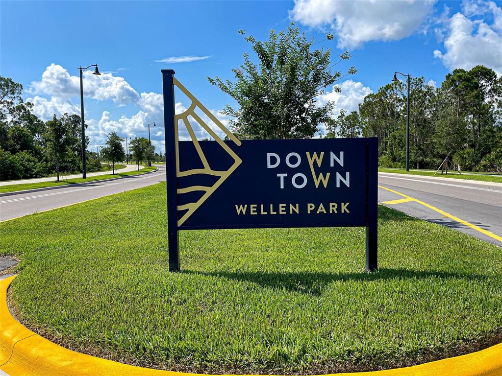 429 Cerromar Lane, Unit 352 Venice, FL 34293 - Photo 45 of 47 a view of a park that has sign board