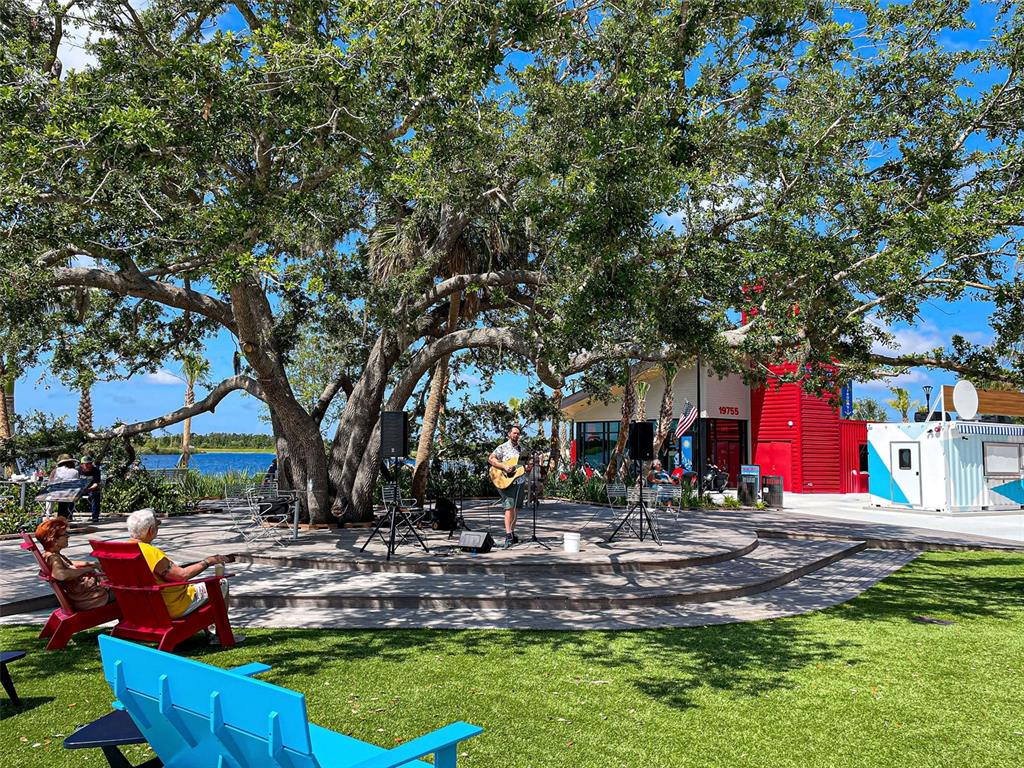 429 Cerromar Lane, Unit 352 Venice, FL 34293 - Photo 47 of 47 a view of a park with large trees