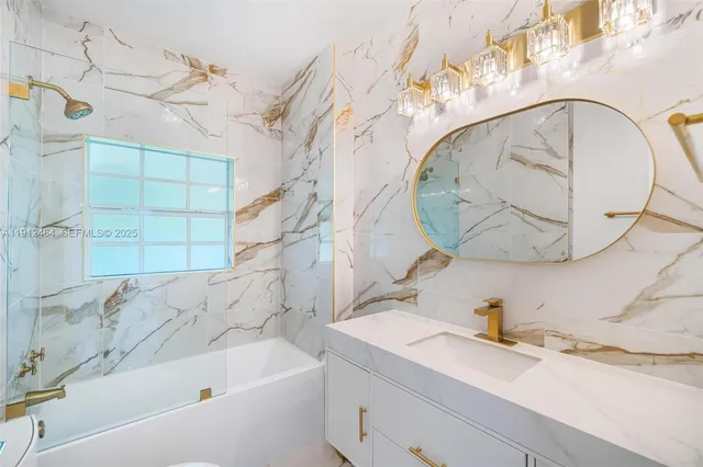 an empty room with a window and wooden floor