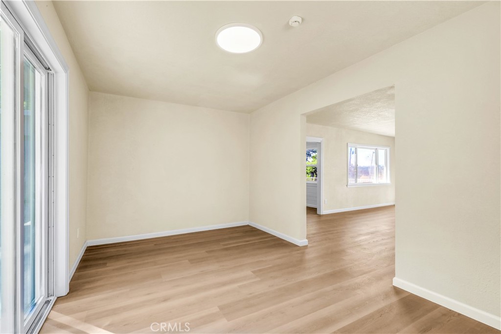 15905 Kugelman Street Lower Lake, CA 95457 - Photo 68 of 75 an empty room with wooden floor and windows