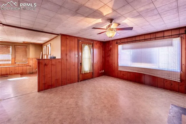 a view of an empty room with a window