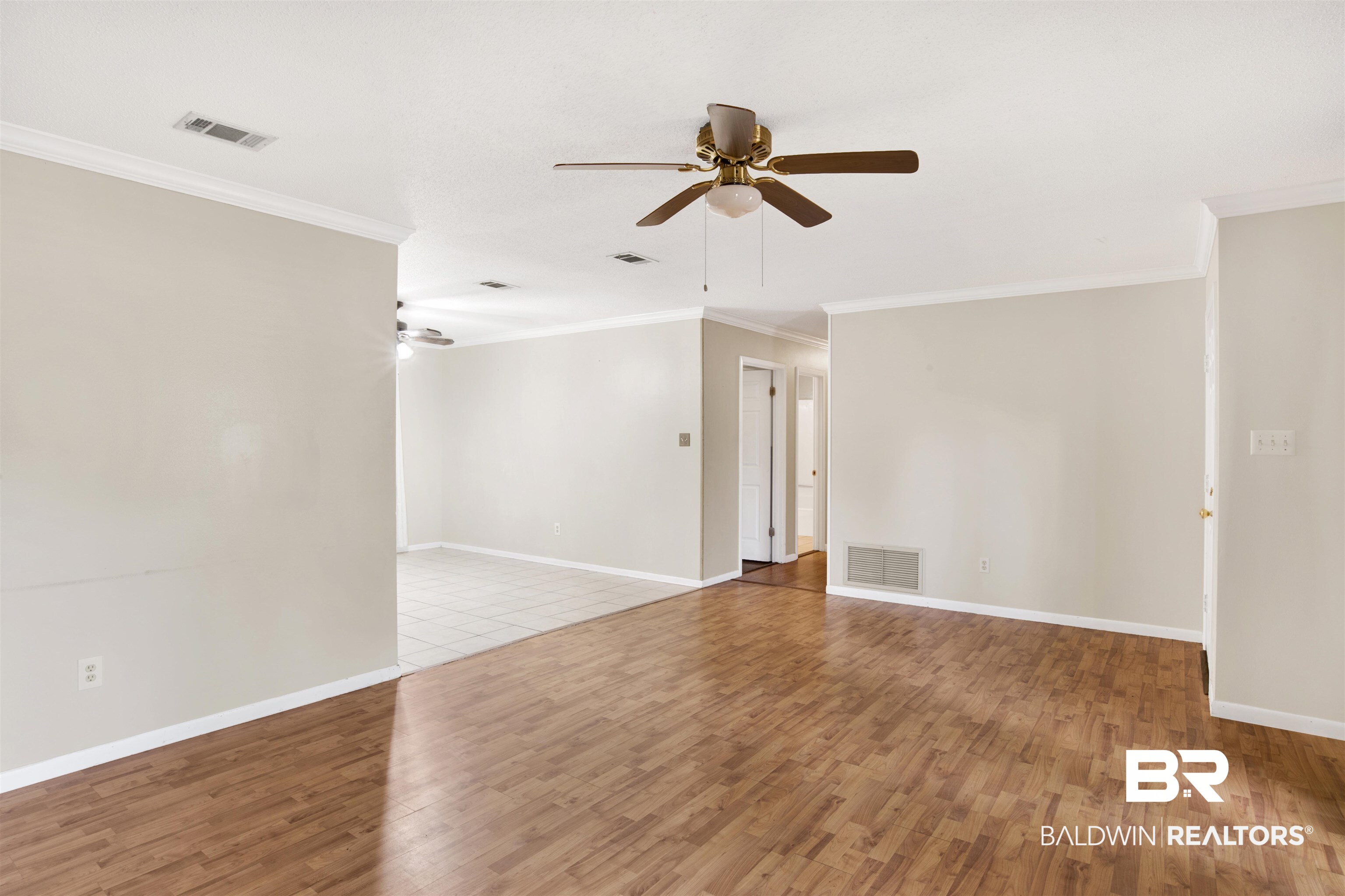 3560 Creekway Road Mobile, AL 36619 - Photo 13 of 24 Tiled empty room featuring ornamental molding and ceiling fan