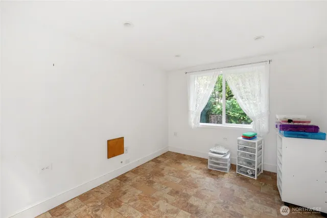 a workspace with furniture and a window