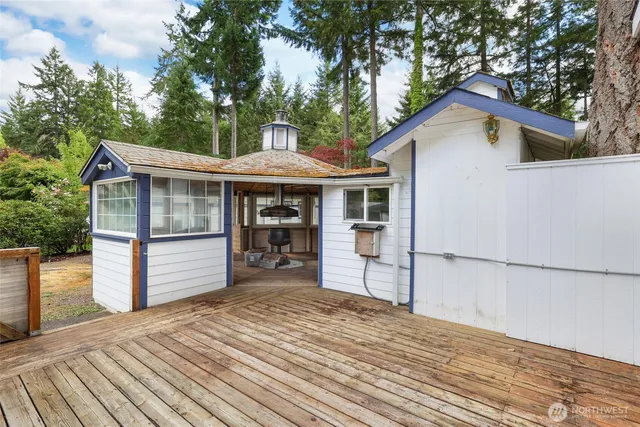 a view of a house with a yard and sitting area