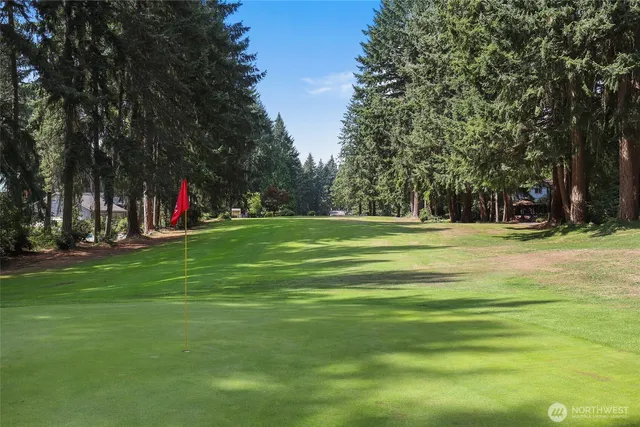 a view of a lake with trees and lake in the back