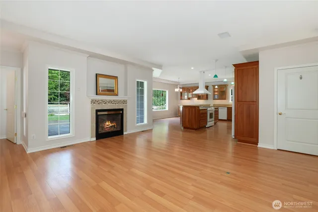 a view of a livingroom with a fireplace and window