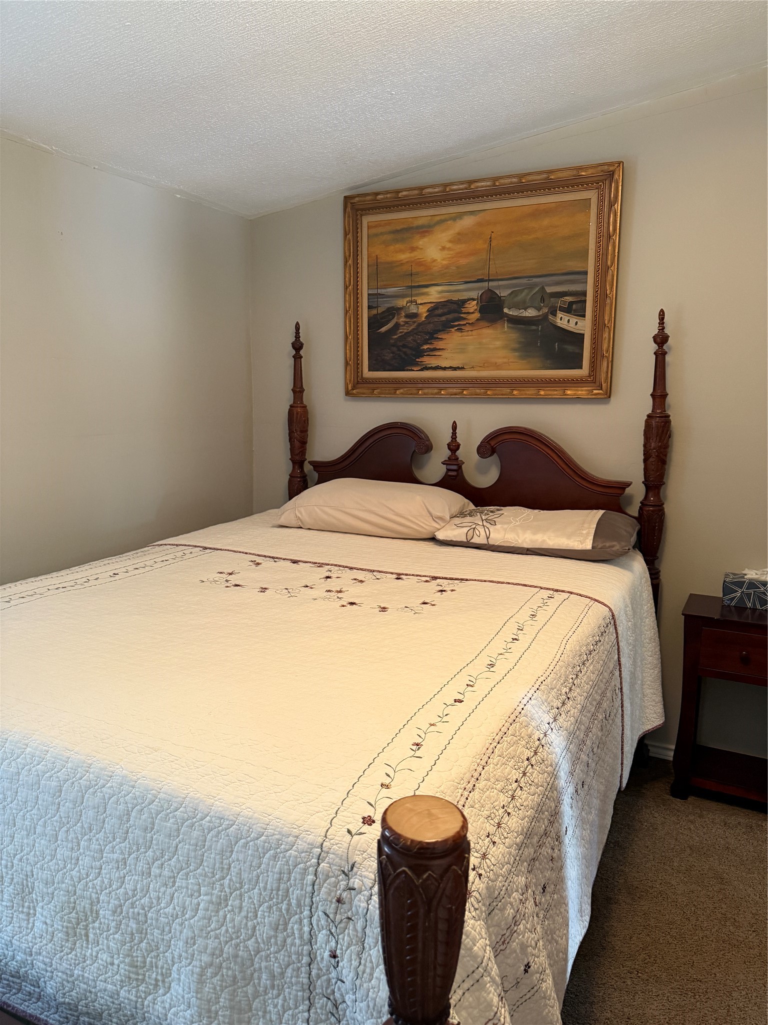 7538 Rocky Ridge Lane Madisonville, TX 77864 - Photo 18 of 48 a bed sitting in a bedroom next to a window