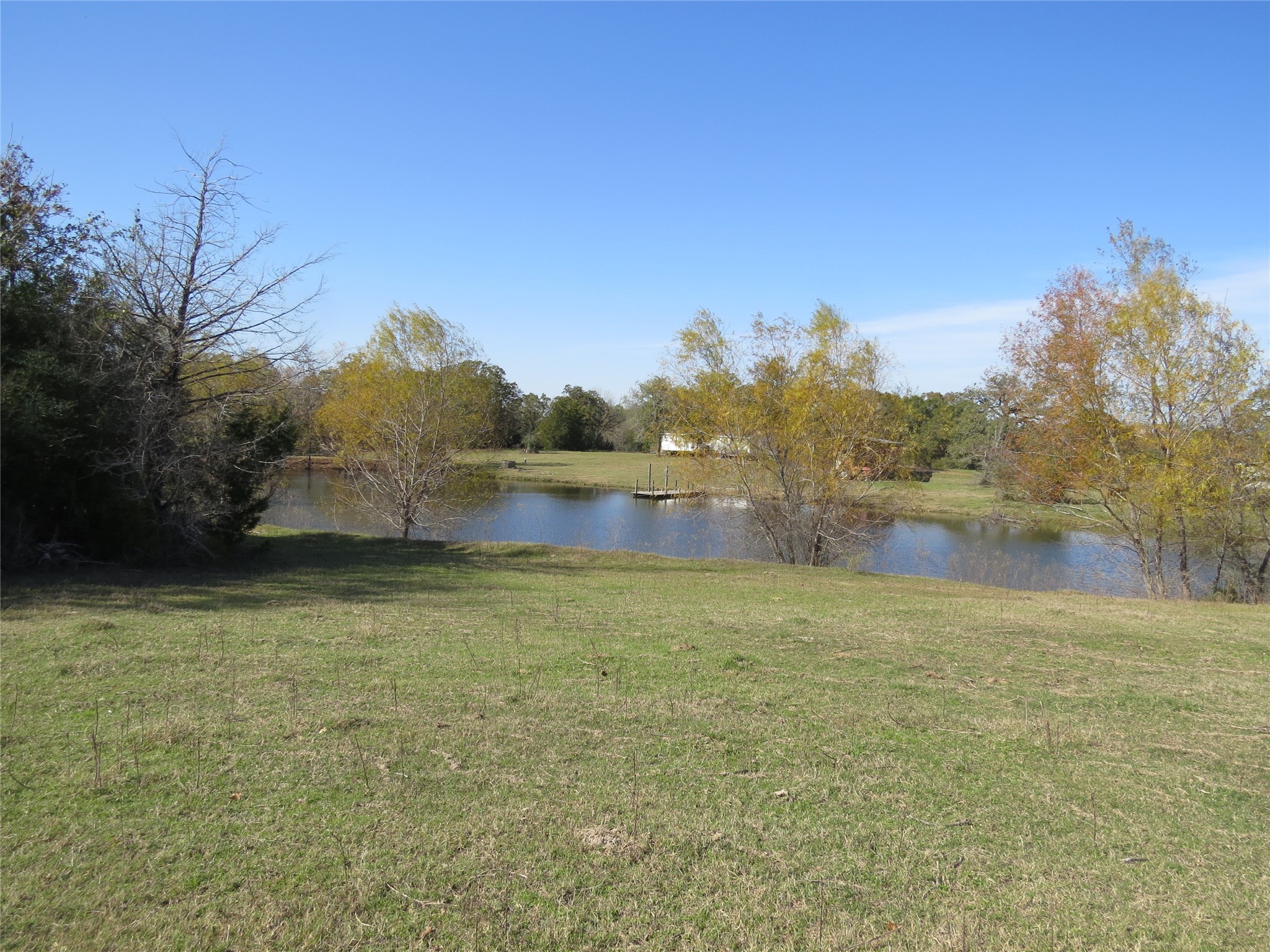 7538 Rocky Ridge Lane Madisonville, TX 77864 - Photo 27 of 48 a view of lake with mountain in the background