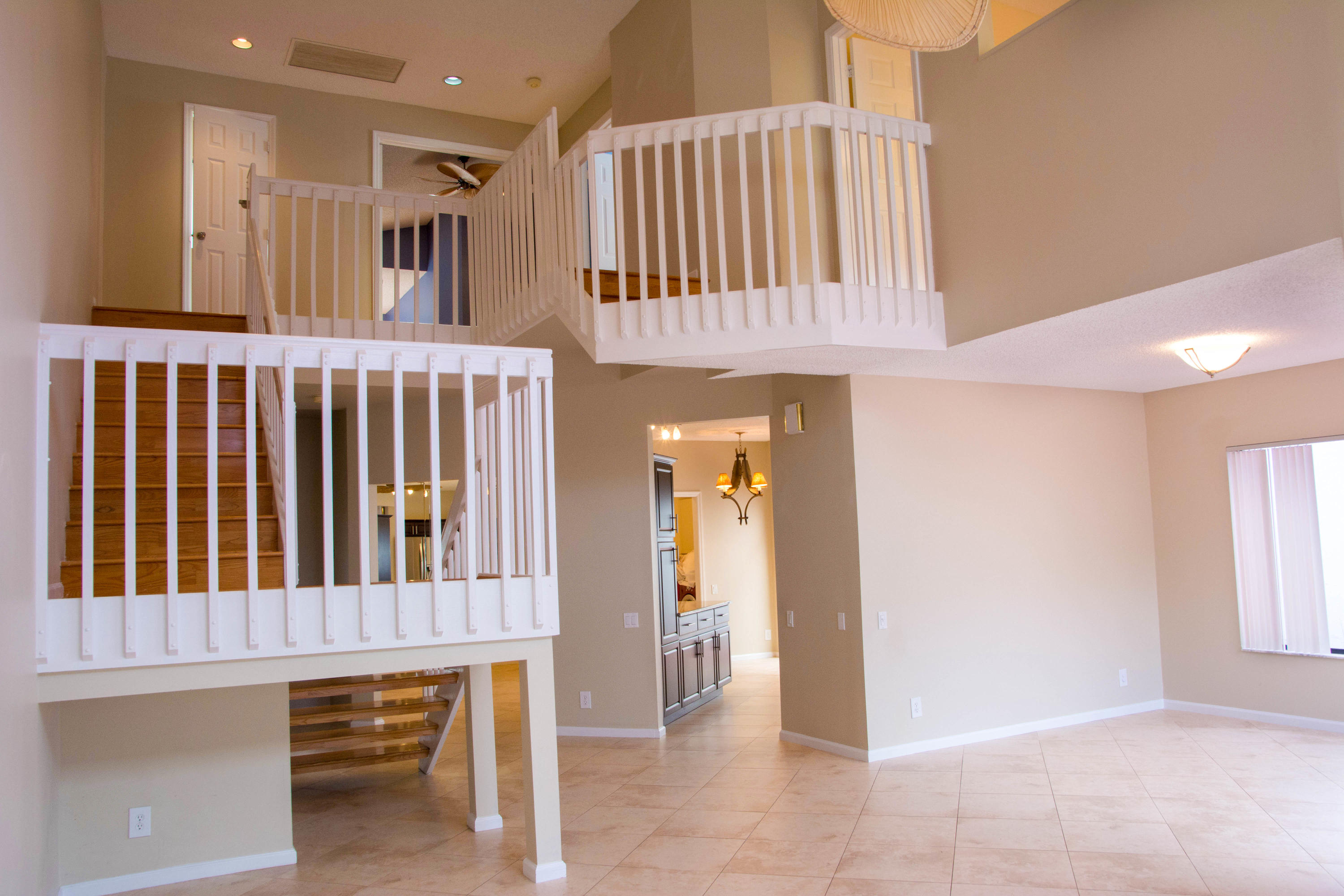 21722 Cromwell Circle Boca Raton, FL 33486 - Photo 10 of 23 21722 SOARING CEILINGS TO UPSTAIRS WITH