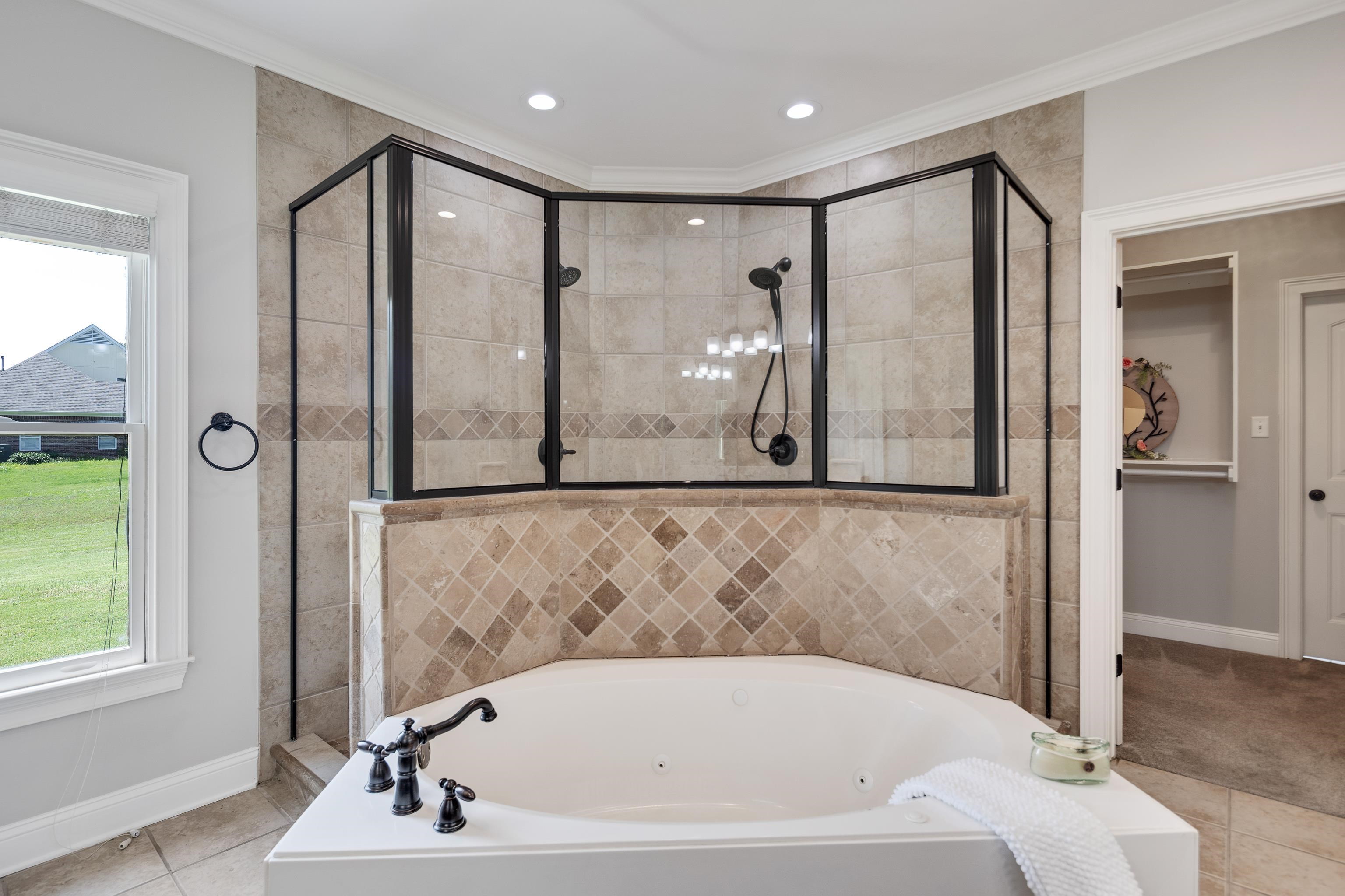 9028 Osborntown Road Arlington, TN 38002 - Photo 24 of 40 a bathroom with a bathtub and a shower