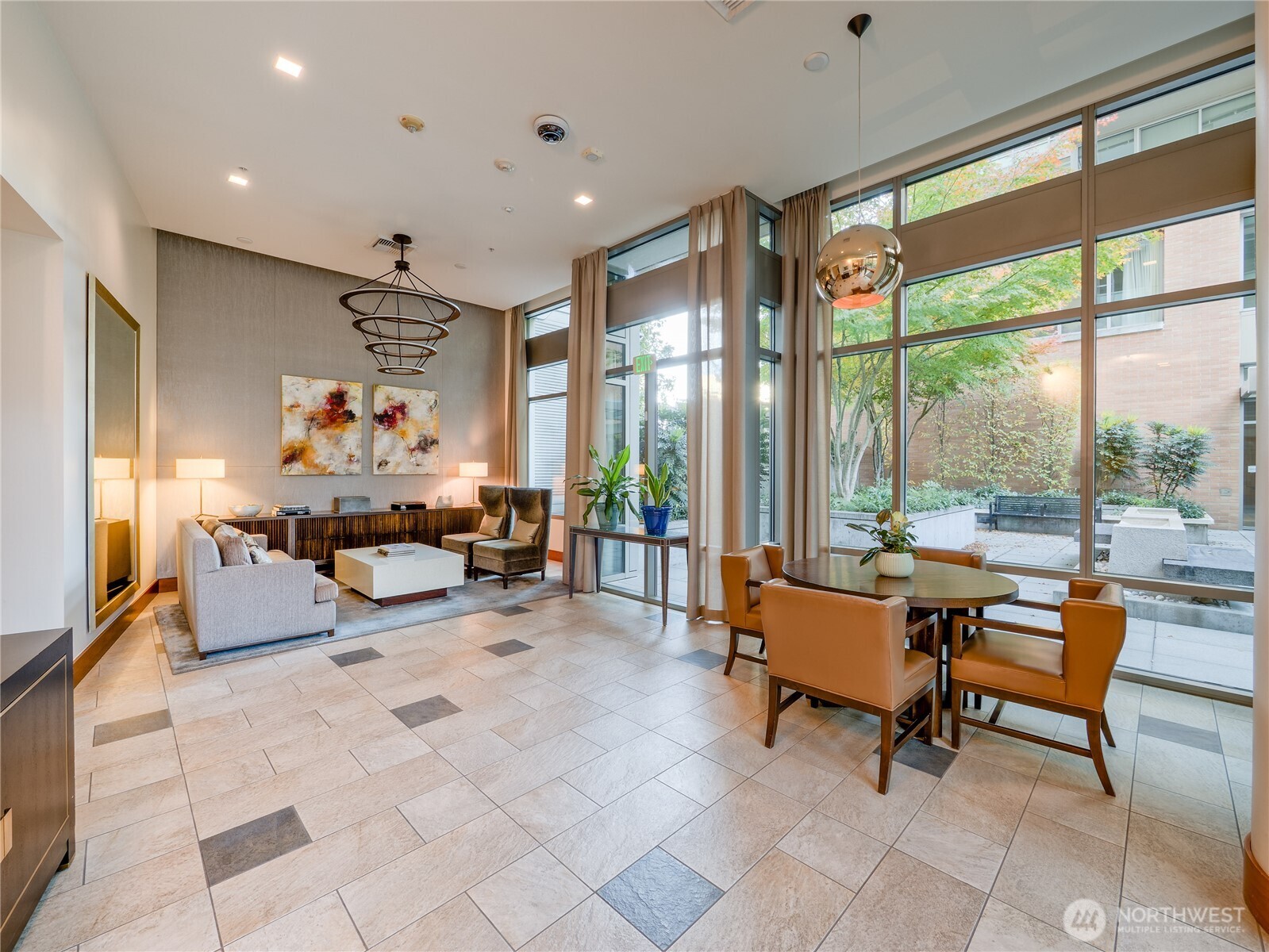 910 Lenora Street, Unit 200 Seattle, WA 98121 - Photo 12 of 23 a living room filled with furniture and a potted plant