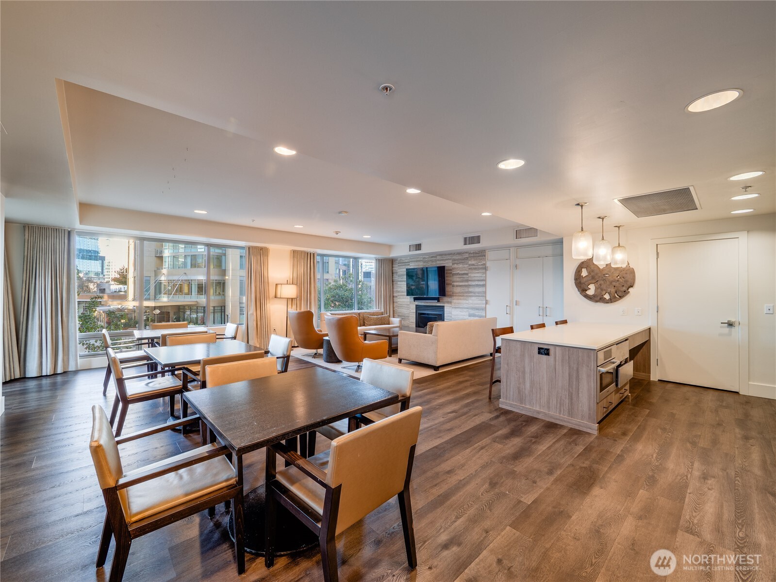 910 Lenora Street, Unit 200 Seattle, WA 98121 - Photo 13 of 23 a living room with furniture and a wooden floor
