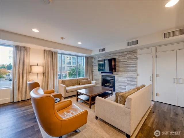 a large kitchen with a table and chairs