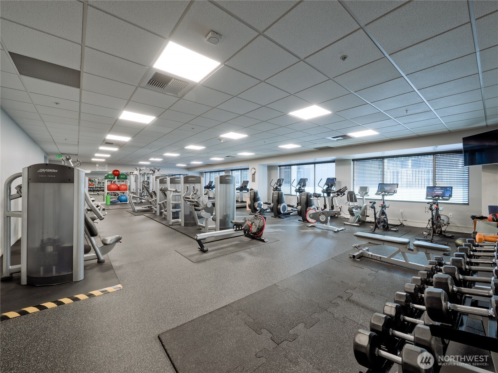 910 Lenora Street, Unit 200 Seattle, WA 98121 - Photo 18 of 23 a view of a room with gym equipment