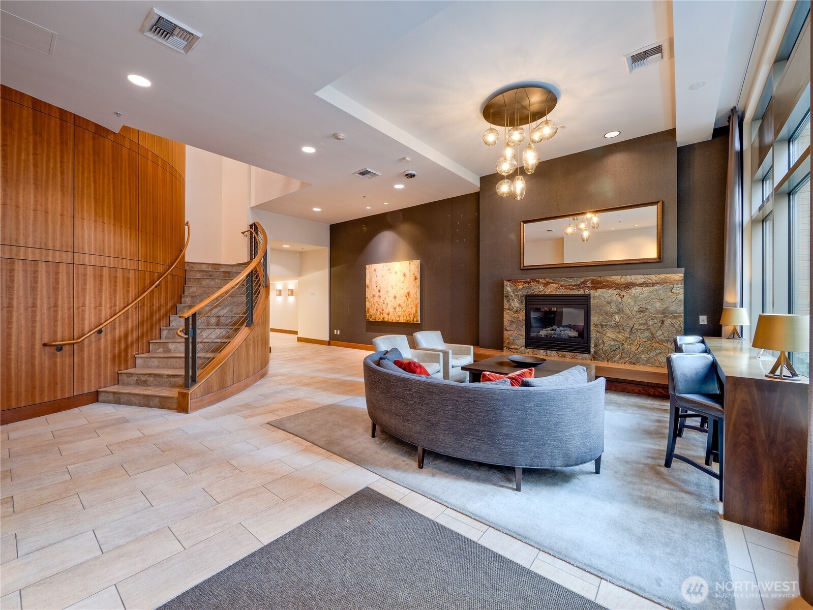 910 Lenora Street, Unit 200 Seattle, WA 98121 - Photo 2 of 23 a living room with furniture and a fireplace