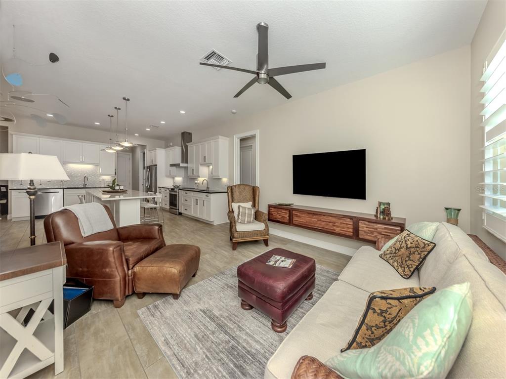 332 Pensacola Road Venice, FL 34285 - Photo 17 of 56 a living room with furniture and a flat screen tv