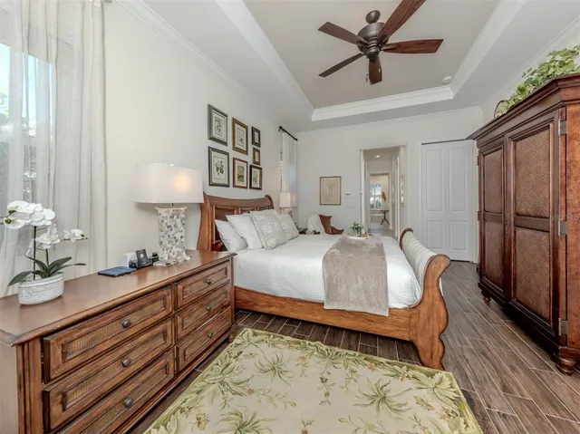 a bedroom with a bed dresser and a window