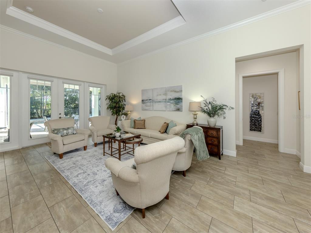 332 Pensacola Road Venice, FL 34285 - Photo 2 of 56 a living room with furniture and a large window