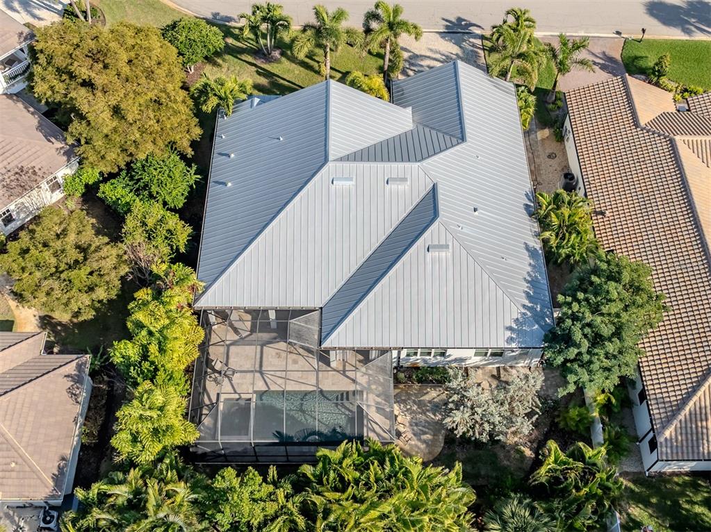 332 Pensacola Road Venice, FL 34285 - Photo 30 of 56 an aerial view of a house with a yard and sitting area