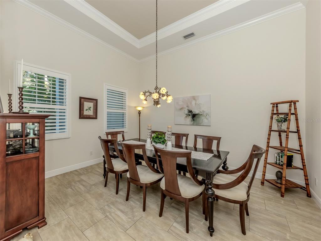 332 Pensacola Road Venice, FL 34285 - Photo 3 of 56 a dining room with furniture and window