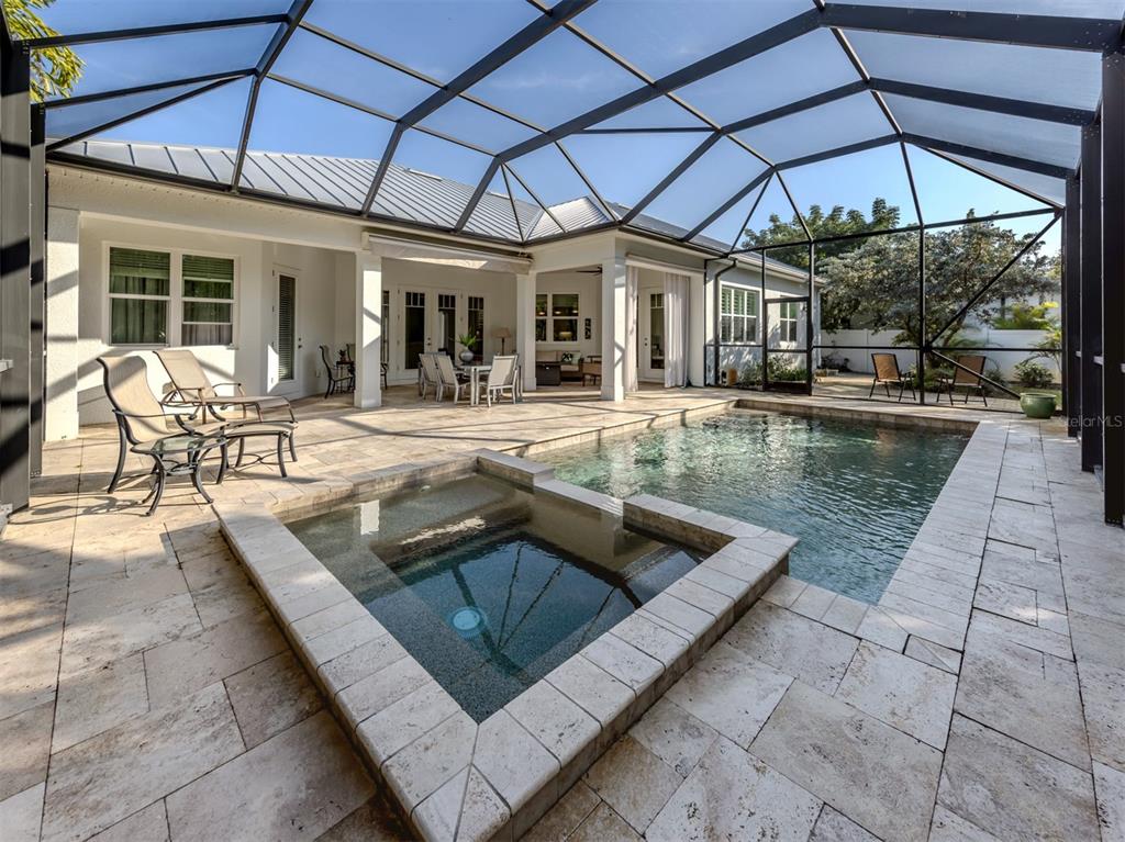 332 Pensacola Road Venice, FL 34285 - Photo 6 of 56 a view of a house with backyard sitting area and swimming pool