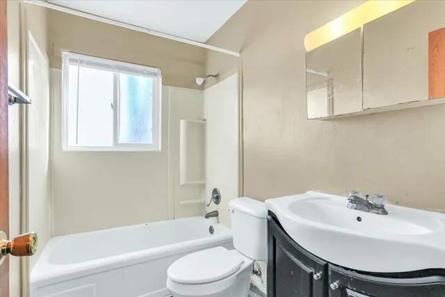 a bathroom with a sink a toilet and a bathtub