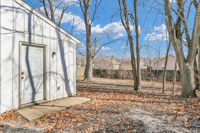 a view of a house with a snow in the yard