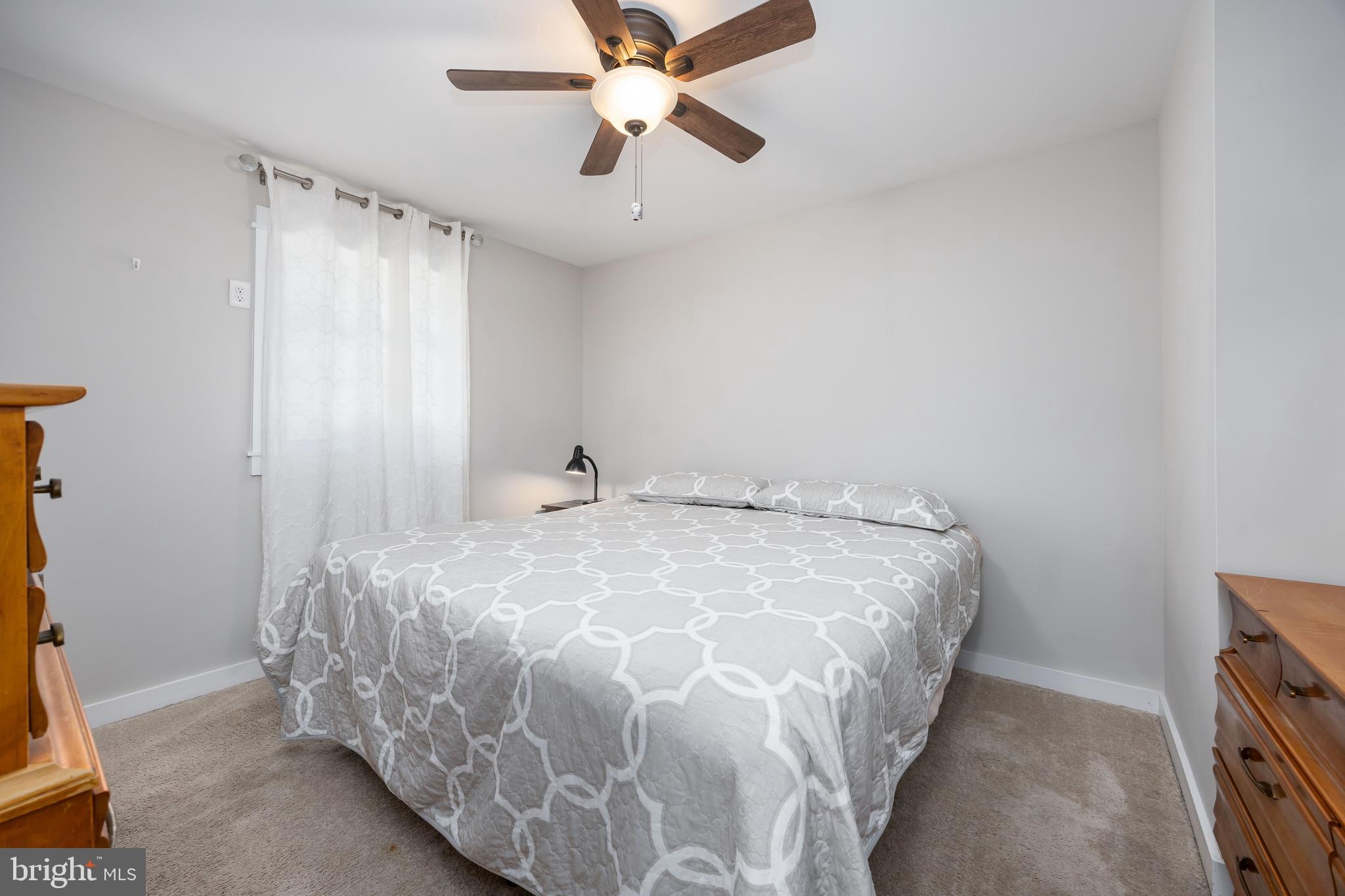 23078 Nanticoke Road Quantico, MD 21856 - Photo 29 of 67 a bed sitting in a room next to a window