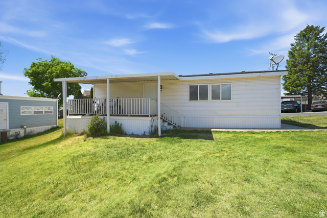 160 Cushing Way Layton, UT 84041 - Photo 2 of 23 Exterior featuring white horizontal siding and a covered front porch with white railings and steps