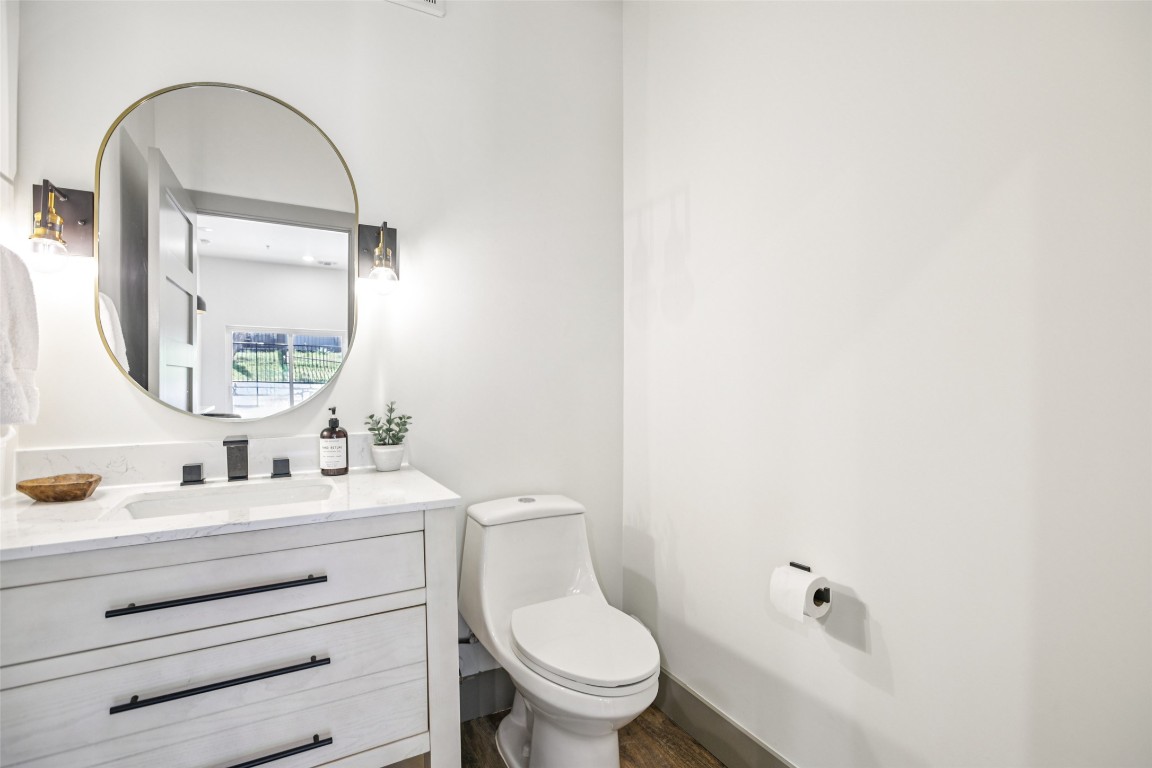 2450 Wickersham Lane, Unit 2023 Austin, TX 78741 - Photo 14 of 27 Bathroom featuring vanity and toilet