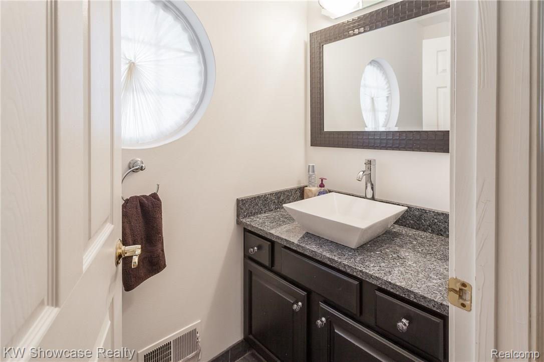 4324 Ridge Court Pinckney, MI 48169 - Photo 16 of 39 Entry Powder Room/ Granite countertops