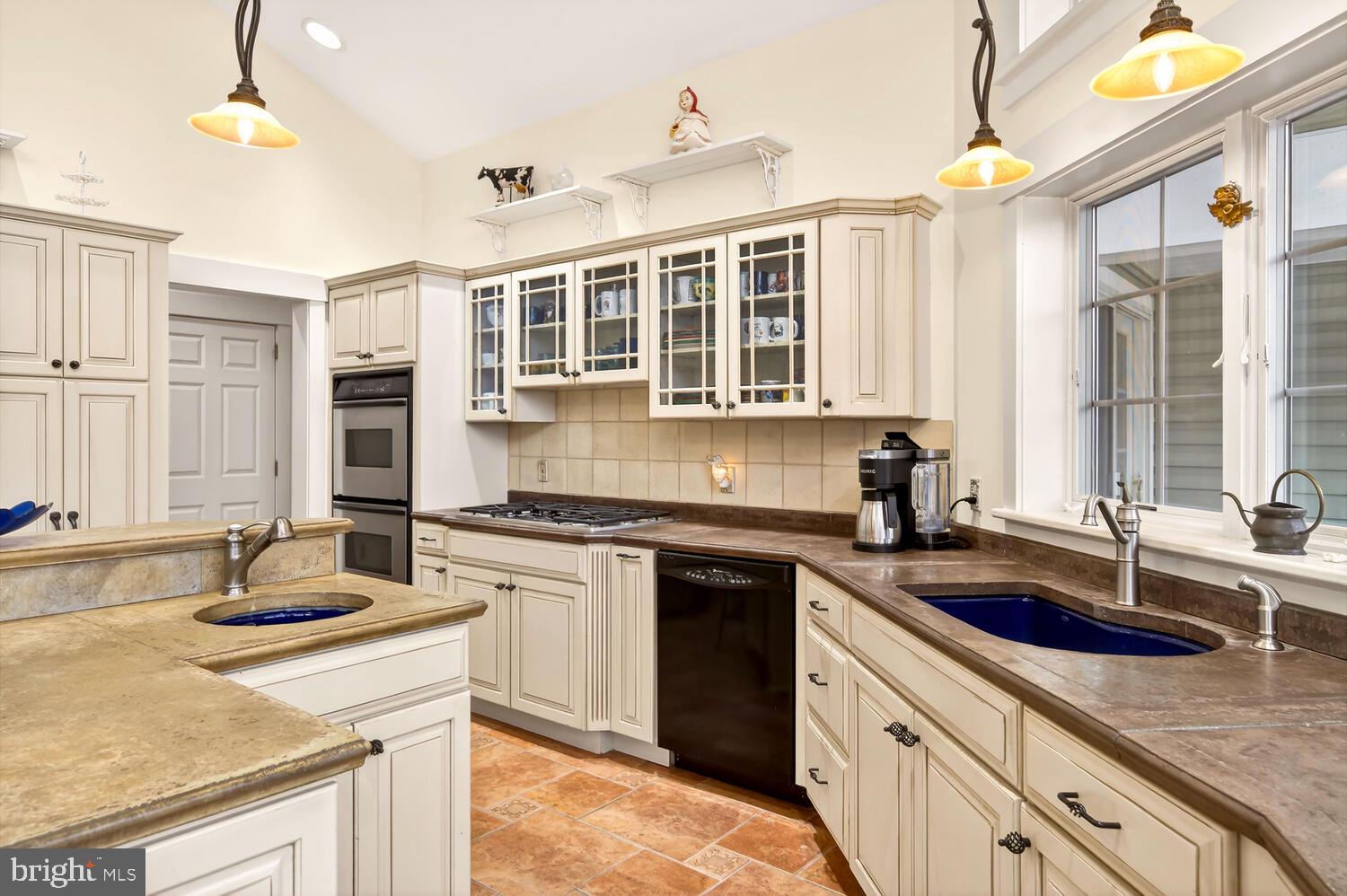 7605 Pendleton Farm Road Easton, MD 21601 - Photo 24 of 62 a kitchen with stainless steel appliances granite countertop a sink stove and cabinets