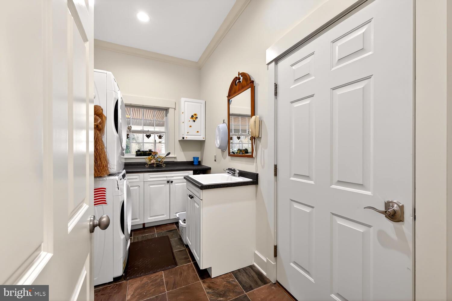 7605 Pendleton Farm Road Easton, MD 21601 - Photo 33 of 62 a kitchen with white cabinets and white appliances