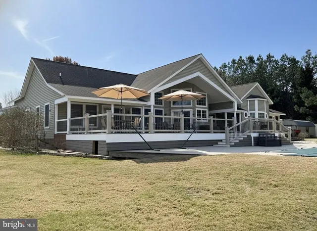 a front view of a house with a yard balcony