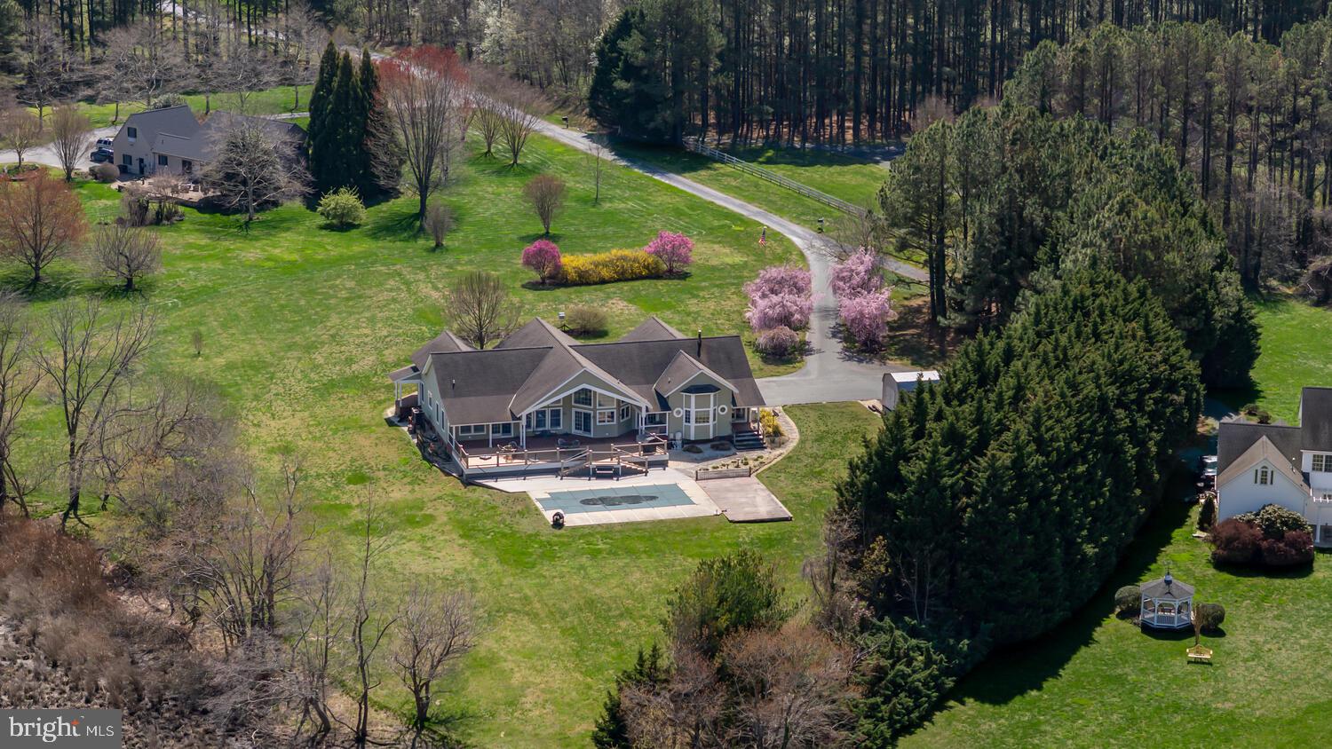 7605 Pendleton Farm Road Easton, MD 21601 - Photo 57 of 62 an aerial view of residential house with outdoor space and swimming pool