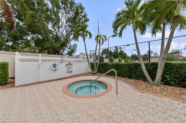 a view of a swimming pool with a patio