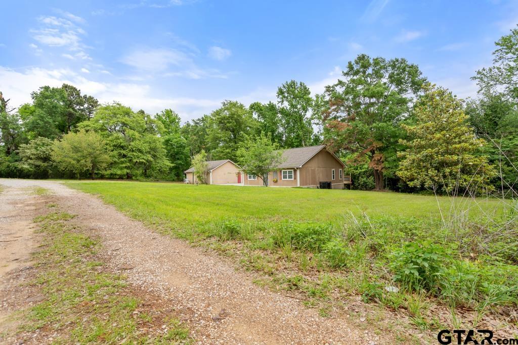 448 North Hill Road Tyler, TX 75706 - Photo 28 of 30 a house with green field in front of it