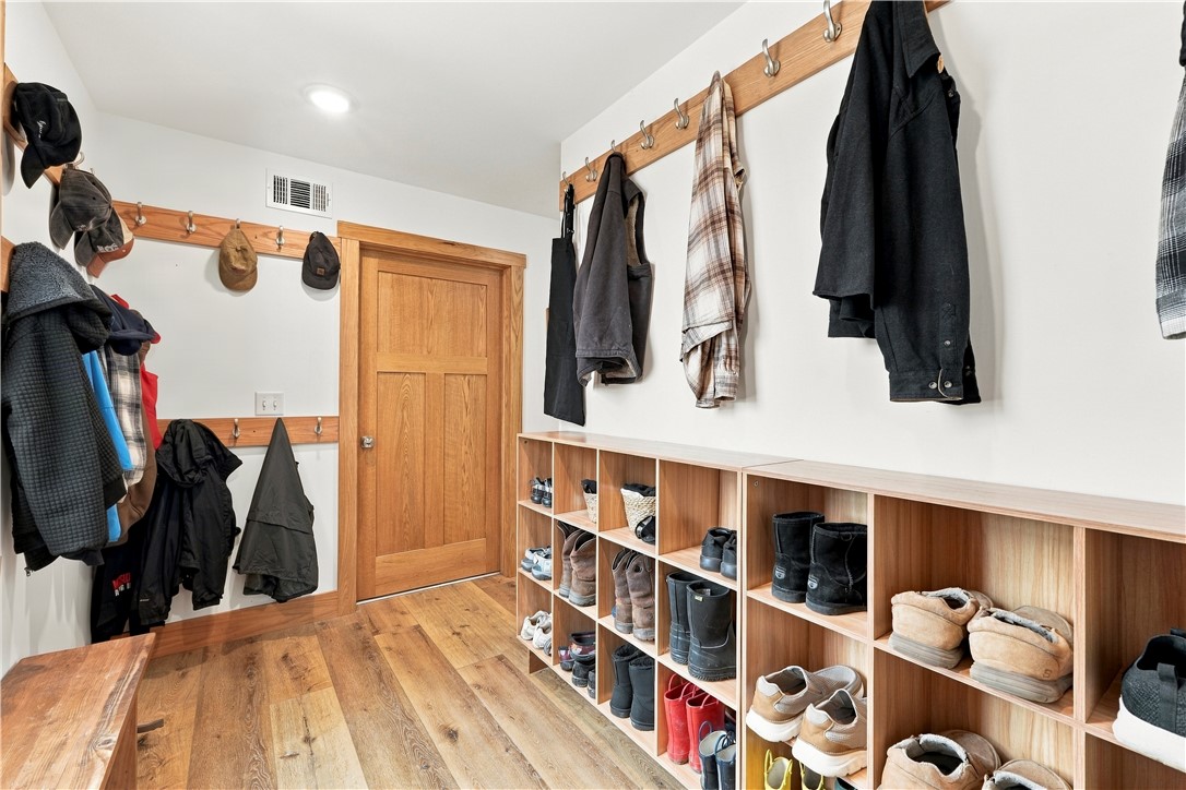 8800 Fred Austin Road Decatur, AR 72722 - Photo 25 of 60 Drop zone in mudroom coming in from garage with plenty of hooks and shoe storage.
