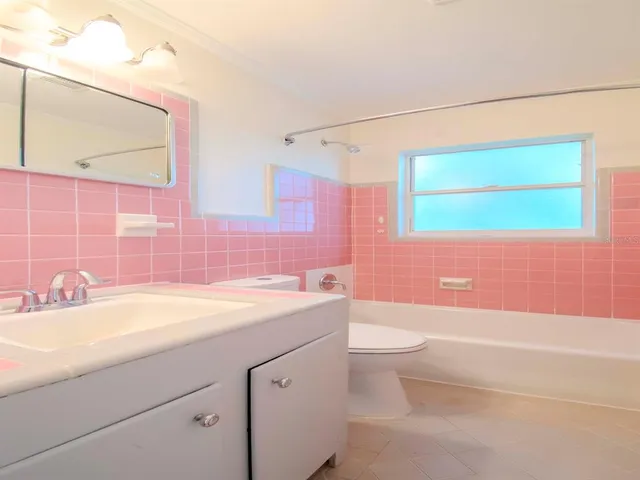 a bathroom with a sink a toilet and a bathtub