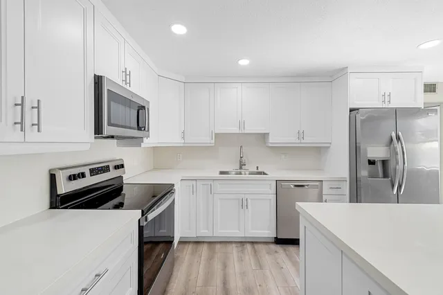 a view of storage and utility room with washer and dryer