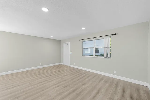 a kitchen with stainless steel appliances a refrigerator sink and microwave